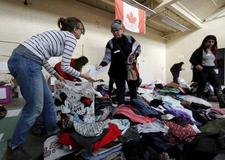 Refugee clothing sorting.jpg